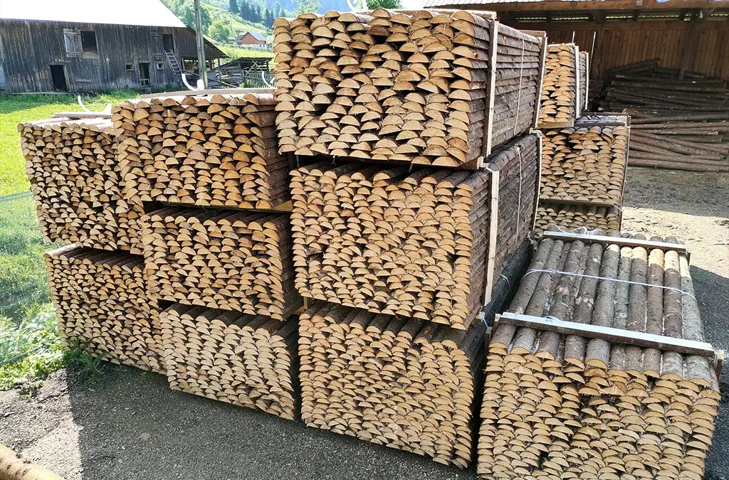 Splitted spruce poles with bark